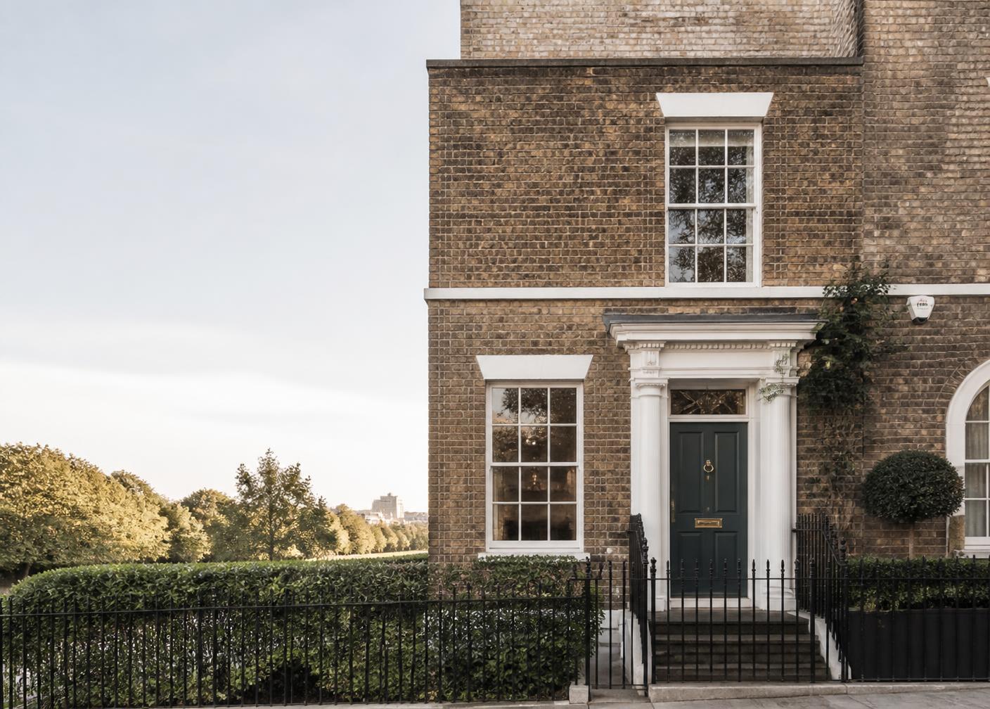 Period UK townhouse exterior in morning light